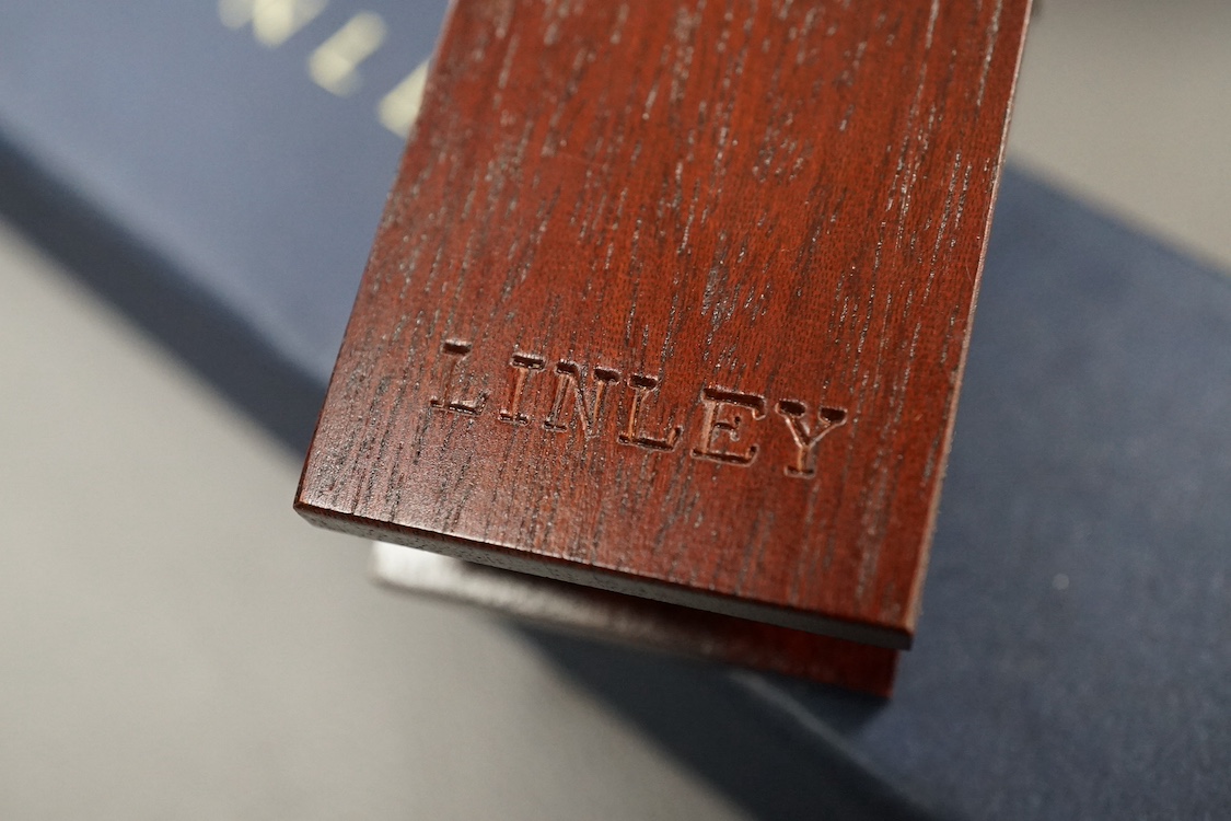 A cased David Linley letter clip in the form of a clothes peg, 15cm in length. Condition - fair, minor scuffs